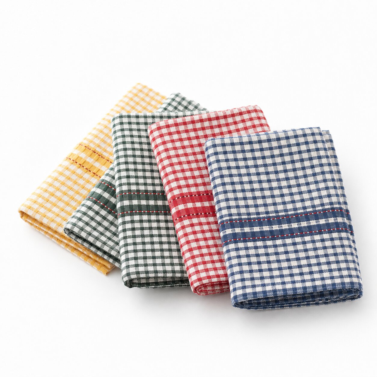 Folded blue, red, green and yellow checkered kitchen towels for hotels, Airbnbs and hospitality properties on a clean white background.