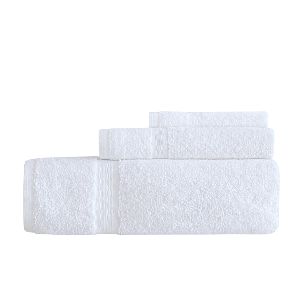 Soft bath towels and hand towels arranged neatly, showcasing a plush texture and a clean, upscale bathroom look
