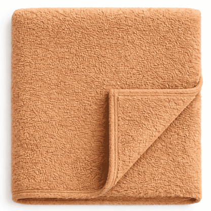 Plush sand fleece blanket with satin trim, soft and cozy for hotel, resort and Airbnb use.