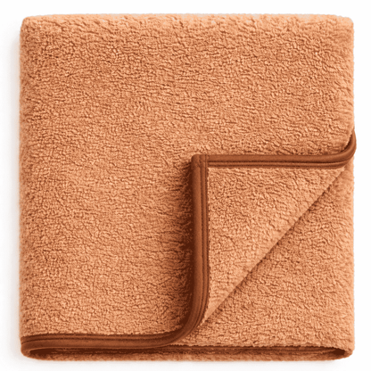 Soft sand fleece blanket with piping, ideal for hotel rooms, resorts and Airbnb and hospitality use.