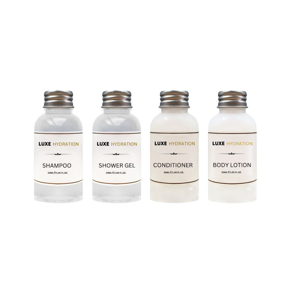 Luxe Hydration 4-piece travel toiletry set with 30ml shampoo, shower gel, conditioner and body lotion for personal care and trips.