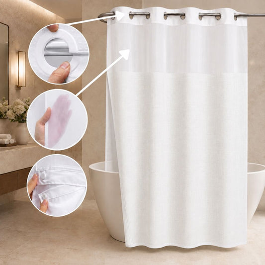White hotel-style shower curtain with sheer top panel, textured lower fabric, snap-in liner detail, and chrome grommets in a modern bathroom.