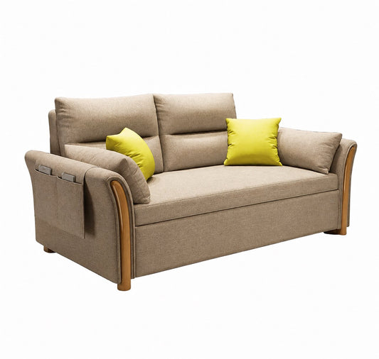 Beige upholstered sofa bed with cushioned backrests, wood-tone arm accents, side storage pocket and yellow decorative pillows.