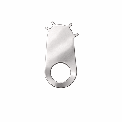 Matte stainless steel multi-tool key with circular grip hole, minimal design on white background, durable compact utility tool.