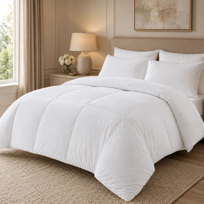 White duvet insert styled on an elegant bed, offering plush warmth, lightweight comfort and a clean bedroom appearance.