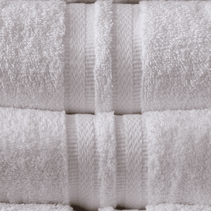 neatly arranged pair of white towels showing the detailing on it
