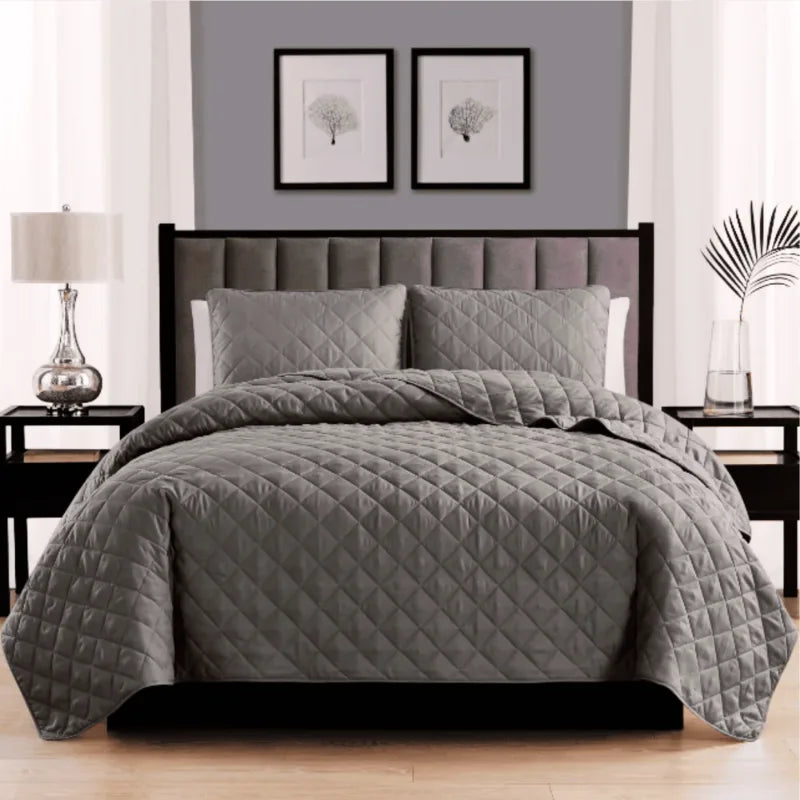 Neat bed with black pillows and comforter