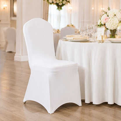 White stretch banquet chair cover styled at an elegant dining table, perfect for weddings, parties and special event décor.