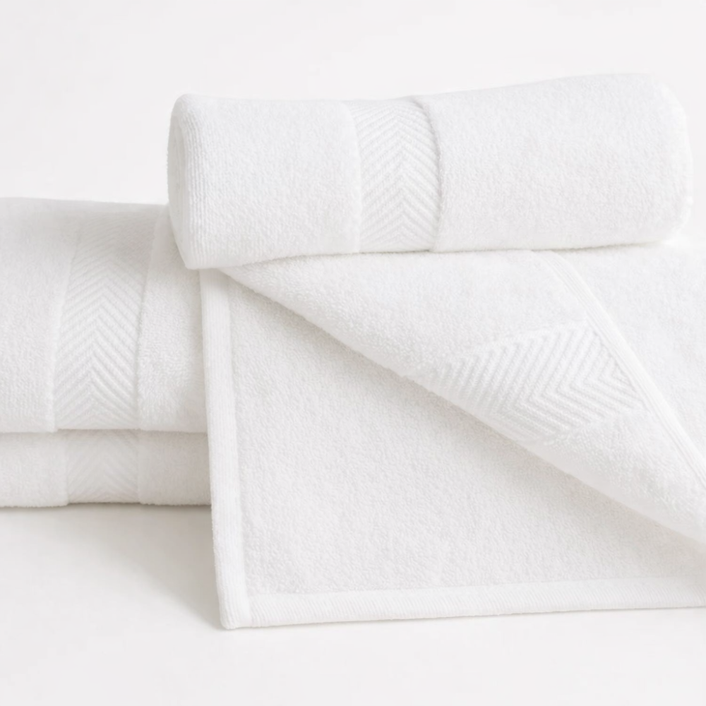 Plush white Turkish cotton towels offering superior absorbency and refined bathroom style