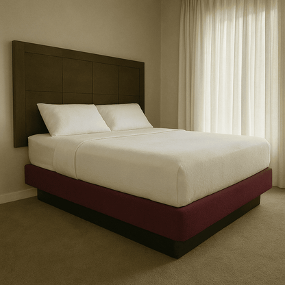Modern hotel bed with burgundy base and white bedding, ideal for upscale hospitality interiors.