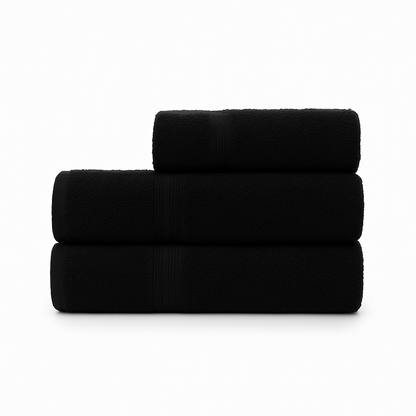 Affordable essential 3-piece black towel set made from 100% combed cotton, soft and durable, perfect for hotels, spas, Airbnbs, or everyday home use