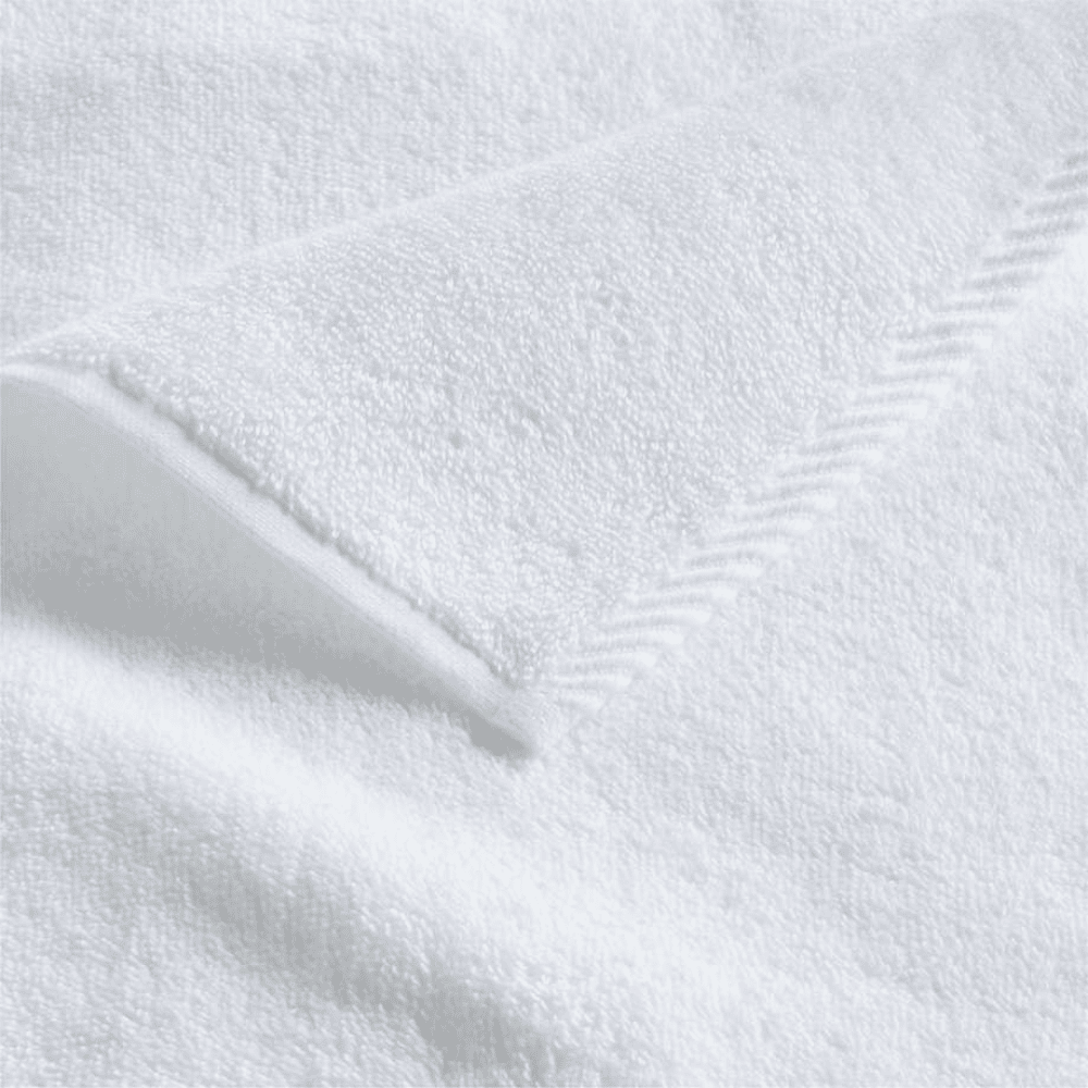 Close-up of cotton bath sheet fabric showcasing a dense, fluffy weave for warmth and everyday indulgence