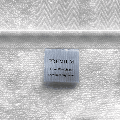 Close-up of a combed cotton bath sheet showcasing a dense, plush weave and a refined decorative border