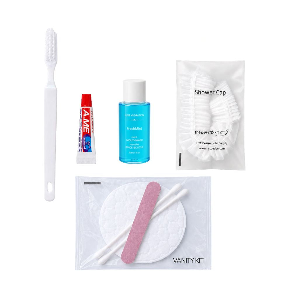 Travel amenity set with toothbrush, toothpaste, mint mouthwash, shower cap and vanity kit for convenient personal care.