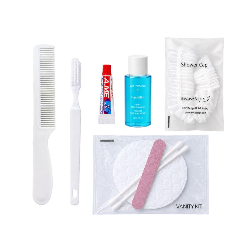 Personal care travel kit with toothbrush, toothpaste, mouthwash, shower cap, vanity kit and compact white comb.