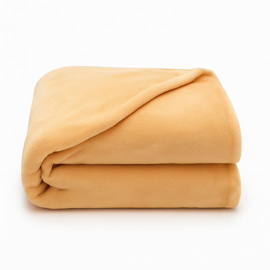 Folded velour fleece blanket in champagne color, ultra-soft, fire-resistant, and hypoallergenic—perfect for luxury hotel or home comfort.