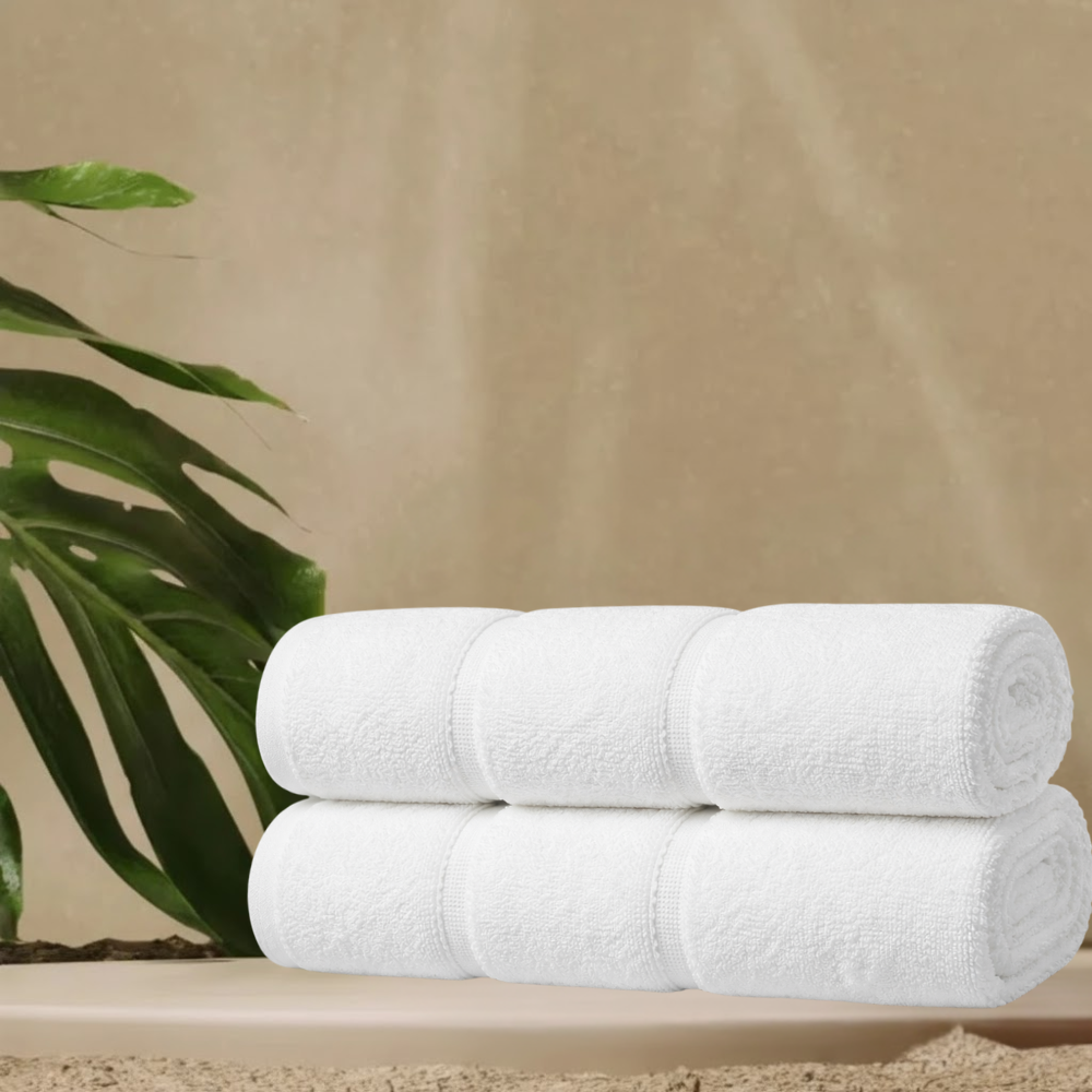 White cotton bath towel displayed neatly, highlighting a dense weave, generous size, and timeless, elegant look
