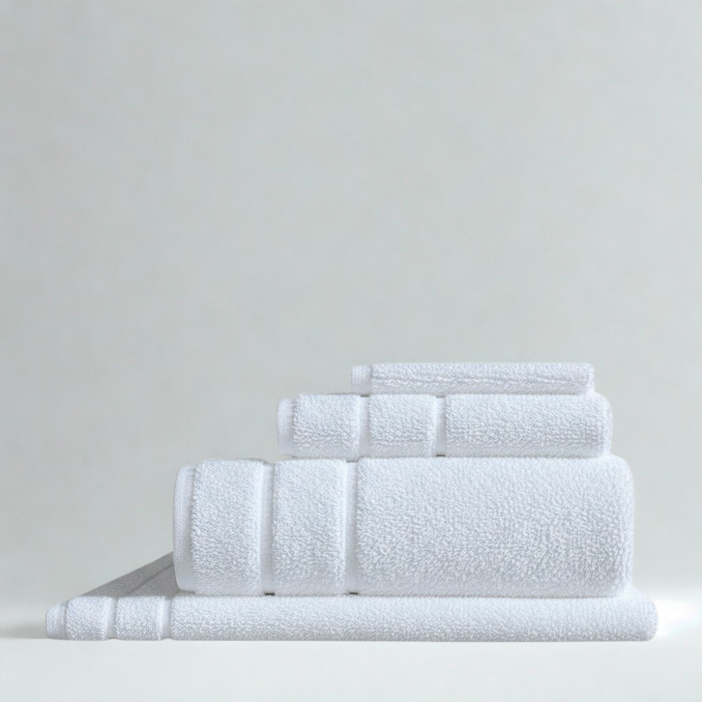 Premium absorbent cotton towel set with bath towels, hand towels, and washcloths in clean white.