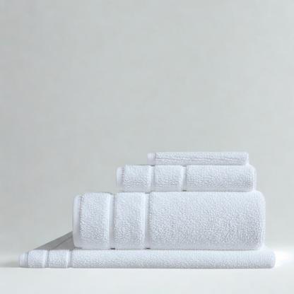 Premium absorbent cotton towel set with bath towels, hand towels, and washcloths in clean white.