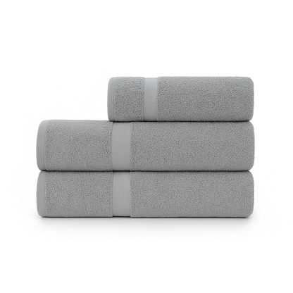 Affordable essential 3-piece grey towel set made from 100% combed cotton, soft and durable, perfect for hotels, spas, Airbnbs, or everyday home use