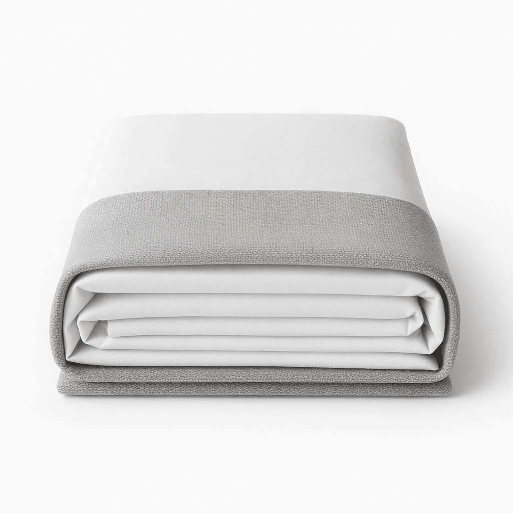 Folded light gray and white bed hugger for hotel rooms, modern and elegant hospitality bedding.
