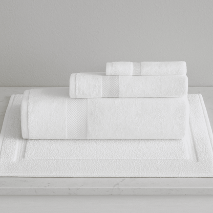 Luxurious Turkish Towel Series white hotel towel set with matching bath mat, plush texture ideal for luxury resorts.