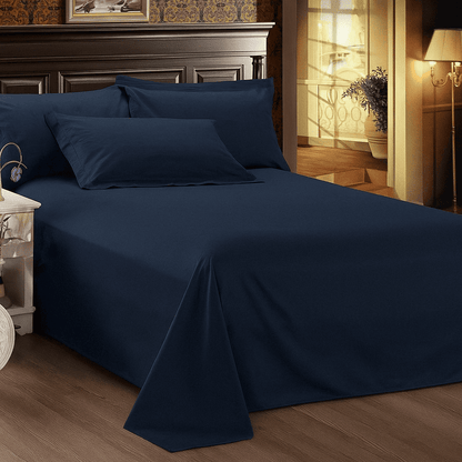 Navy blue bed sheet elegant décor and warm lighting, perfect for resort, Airbnb, hotel and hospitality use.