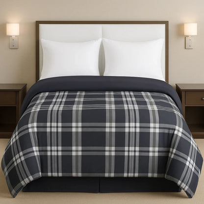Grey plaid comforter styled on a neatly made bed with crisp white pillows for a classic, modern bedroom look.