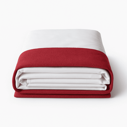Folded red and white bed hugger for hotel rooms, modern design with durable textured fabric. Perfect for Hospitality use.