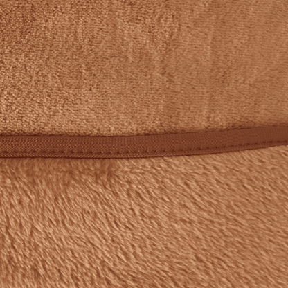 Close-up of velour fleece blanket texture in sand color, showing plush softness and high-quality finish for luxury hotel or home use.