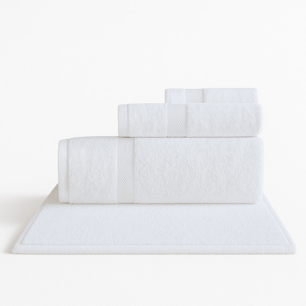 Luxurious Turkish Towel Series white towel set with bath mat on pure white background, soft cotton for upscale hotels.